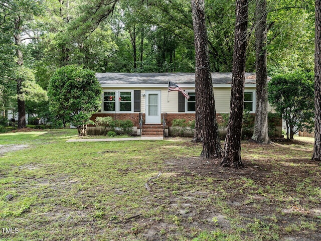203 Lane Of Sir Kay, Garner, NC 27529 - view of front facade with brick siding, entry steps, and a front yard