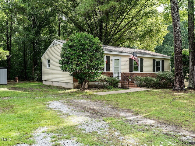 203 Lane Of Sir Kay, Garner, NC 27529 - view of front of house featuring a front lawn and brick siding