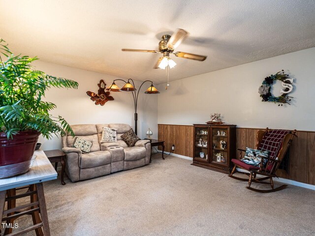 203 Lane Of Sir Kay, Garner, NC 27529 - living room featuring carpet flooring, a ceiling fan, wainscoting, and wooden walls
