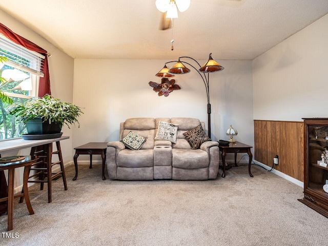203 Lane Of Sir Kay, Garner, NC 27529 - living room featuring carpet, a ceiling fan, and a wainscoted wall