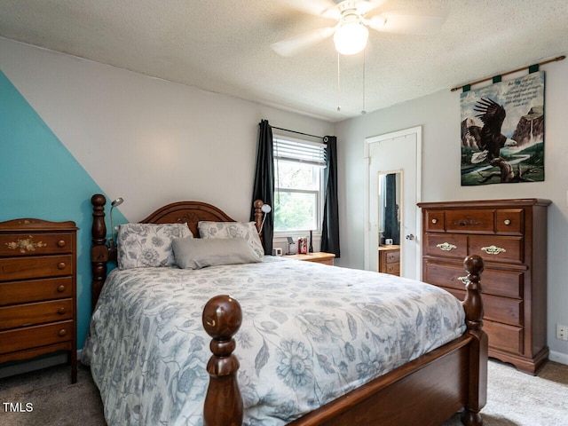 203 Lane Of Sir Kay, Garner, NC 27529 - bedroom featuring carpet flooring, a textured ceiling, a ceiling fan, and ensuite bath
