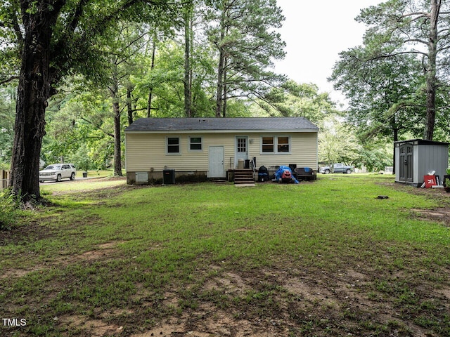 203 Lane Of Sir Kay, Garner, NC 27529 - rear view of house featuring a lawn, crawl space, a storage shed, and entry steps