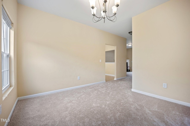 702 Calavaras Ln, Knightdale, NC 27545 - carpeted spare room with a chandelier and baseboards