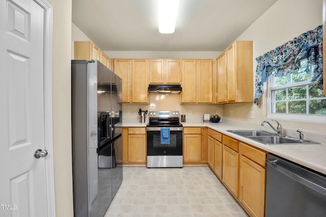 702 Calavaras Ln, Knightdale, NC 27545 - kitchen with stainless steel appliances, under cabinet range hood, light brown cabinetry, and light countertops
