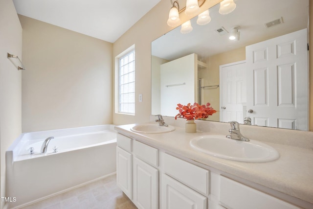 702 Calavaras Ln, Knightdale, NC 27545 - full bath with double vanity and a garden tub