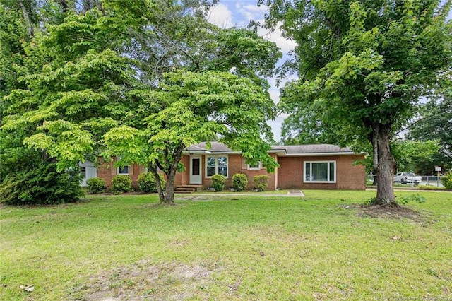 6425 Morganton Rd, Fayetteville, NC 28314 - view of front facade with a front lawn