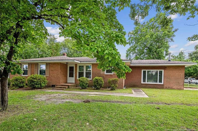 6425 Morganton Rd, Fayetteville, NC 28314 - ranch-style house with a front yard and brick siding