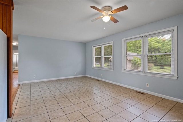 6425 Morganton Rd, Fayetteville, NC 28314 - spare room featuring a ceiling fan, light tile patterned flooring, and baseboards