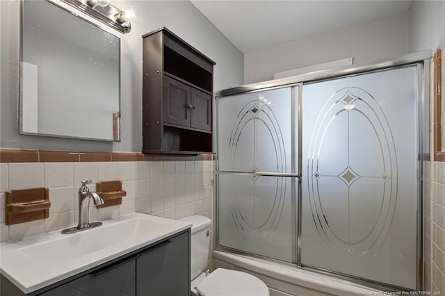 6425 Morganton Rd, Fayetteville, NC 28314 - full bathroom with toilet, tile walls, vanity, and combined bath / shower with glass door
