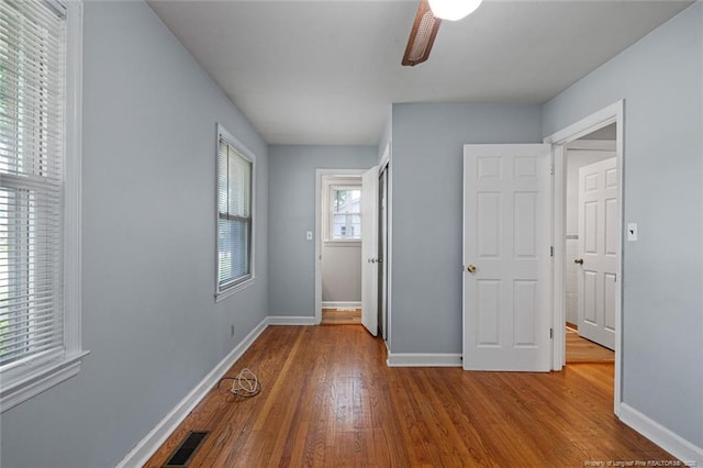 6425 Morganton Rd, Fayetteville, NC 28314 - unfurnished bedroom featuring wood finished floors, baseboards, and ceiling fan