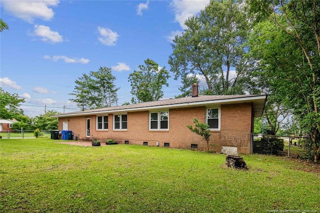 6425 Morganton Rd, Fayetteville, NC 28314 - back of house featuring brick siding and a chimney