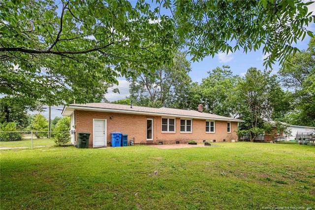 6425 Morganton Rd, Fayetteville, NC 28314 - back of house with brick siding and a chimney