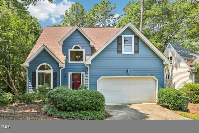 316 Trafalgar Ln, Cary, NC 27513 - traditional-style house featuring asphalt driveway, an attached garage, and roof with shingles