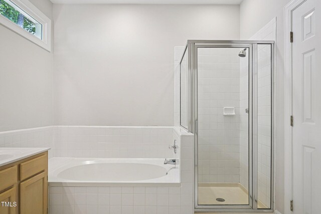 316 Trafalgar Ln, Cary, NC 27513 - bathroom featuring a garden tub, a shower stall, and vanity
