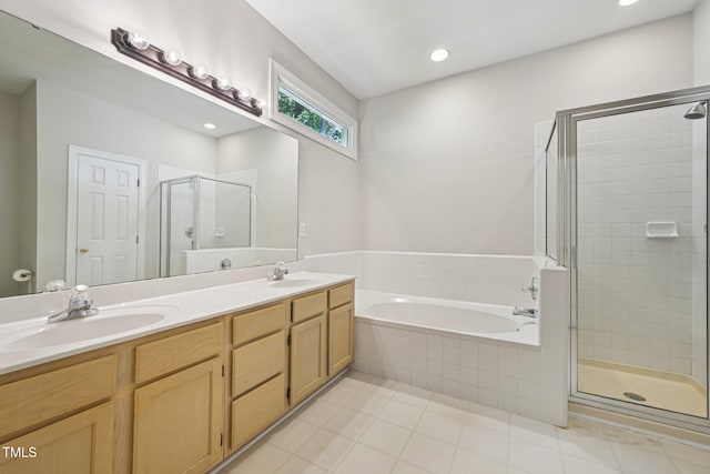 316 Trafalgar Ln, Cary, NC 27513 - full bathroom featuring a shower stall, a bath, double vanity, tile patterned floors, and recessed lighting