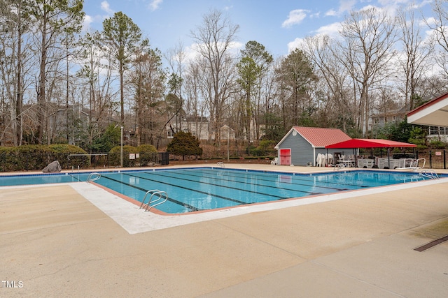 316 Trafalgar Ln, Cary, NC 27513 - community pool with a patio and view of scattered trees