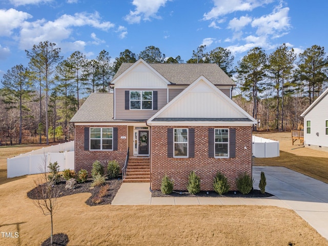 40 Ironwood Blvd, Youngsville, NC 27596 - view of front facade featuring brick siding, board and batten siding, and roof with shingles