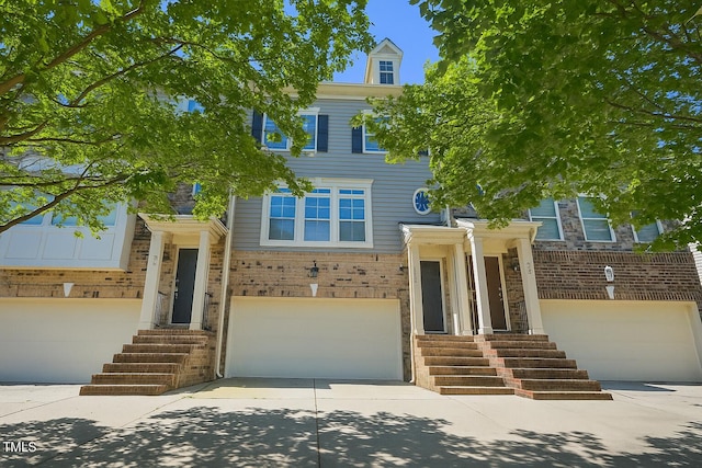 453 Panorama Park Pl, Cary, NC 27519 - view of front of property featuring a garage, driveway, and brick siding
