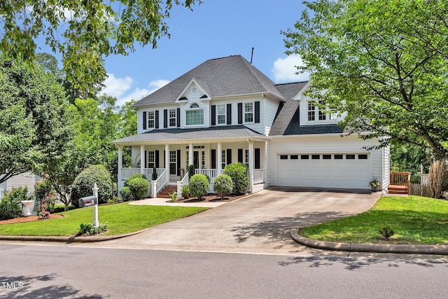 100 Highfield Ave, Cary, NC 27519 - view of front of home with concrete driveway, covered porch, a front yard, a shingled roof, and a garage