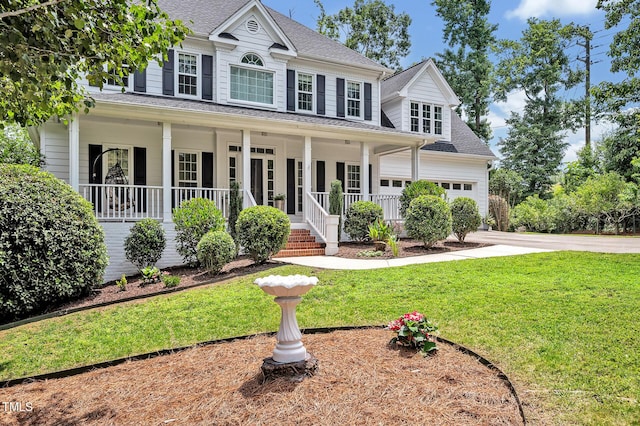 100 Highfield Ave, Cary, NC 27519 - colonial house with a porch, roof with shingles, a front yard, concrete driveway, and a garage
