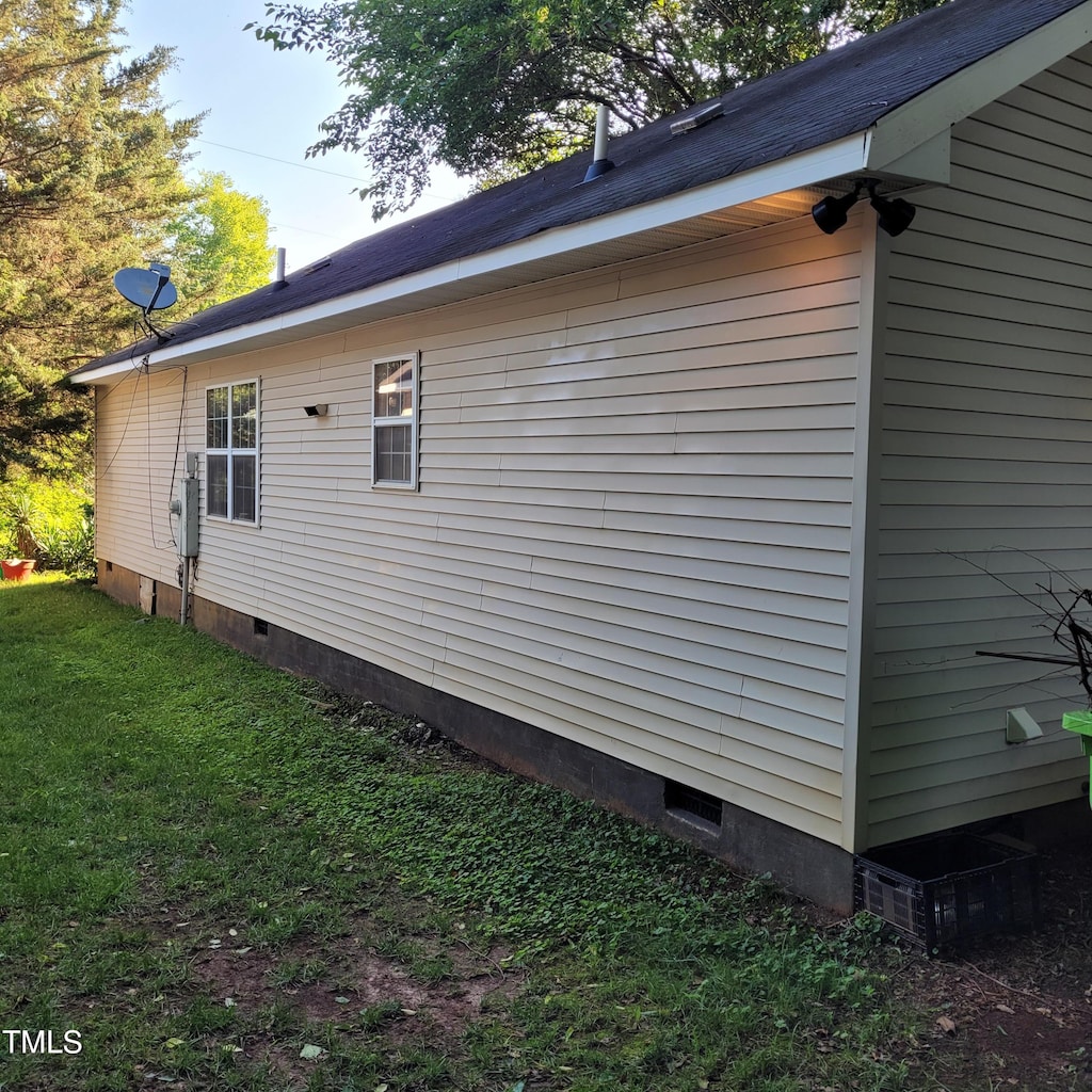 1512 E Lane St, Raleigh, NC 27610 - view of property exterior featuring crawl space and a yard