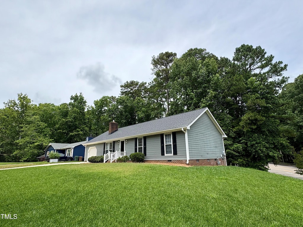 100 Honeysuckle Ln, Cary, NC 27513 - ranch-style home with crawl space, an attached garage, a front yard, a chimney, and a shingled roof