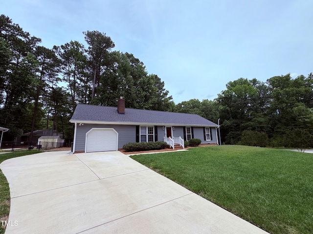 100 Honeysuckle Ln, Cary, NC 27513 - single story home with concrete driveway, a garage, a chimney, and a front lawn