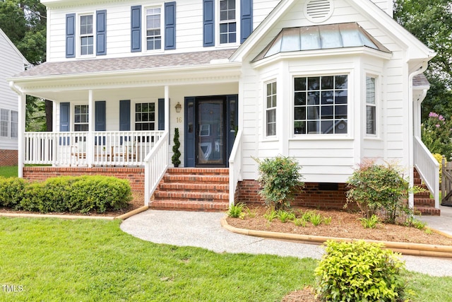 16 Cedar Hill Dr, Durham, NC 27713 - view of front of house with covered porch, a shingled roof, a front lawn, and a standing seam roof