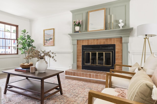 16 Cedar Hill Dr, Durham, NC 27713 - living area with a decorative wall, a fireplace, crown molding, a wainscoted wall, and wood finished floors