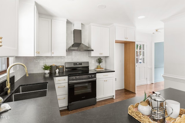 16 Cedar Hill Dr, Durham, NC 27713 - kitchen featuring electric stove, wall chimney exhaust hood, tasteful backsplash, white cabinets, and recessed lighting