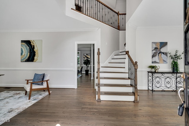 12 Gatesway Ct, Durham, NC 27707 - stairway featuring a towering ceiling, wood finished floors, and crown molding