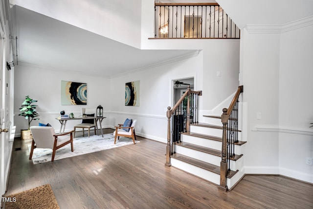 12 Gatesway Ct, Durham, NC 27707 - entryway with wood finished floors, crown molding, stairway, and a towering ceiling