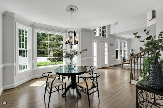 12 Gatesway Ct, Durham, NC 27707 - dining room with wood finished floors, a chandelier, and crown molding