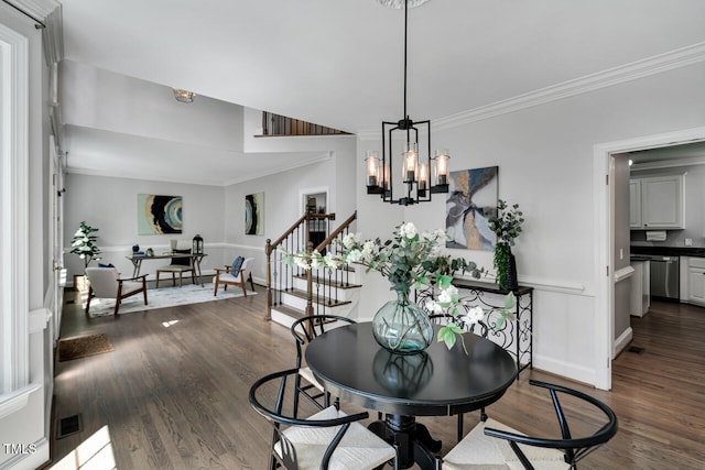 12 Gatesway Ct, Durham, NC 27707 - dining room with stairway, dark wood finished floors, ornamental molding, and a chandelier