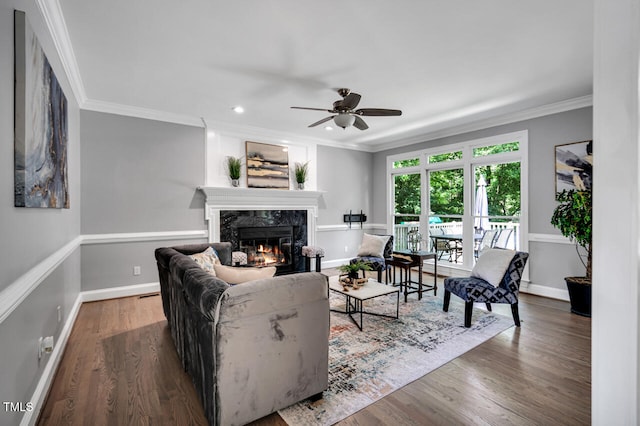 12 Gatesway Ct, Durham, NC 27707 - living room with a fireplace, ceiling fan, ornamental molding, wood finished floors, and recessed lighting