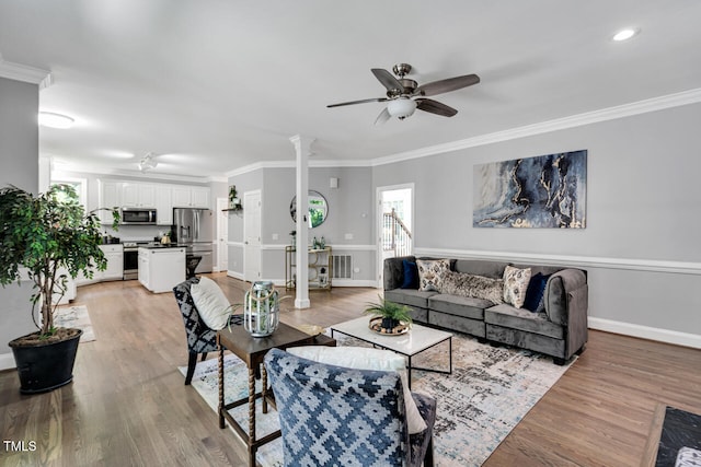 12 Gatesway Ct, Durham, NC 27707 - living room featuring a ceiling fan, ornamental molding, ornate columns, light wood-style floors, and recessed lighting