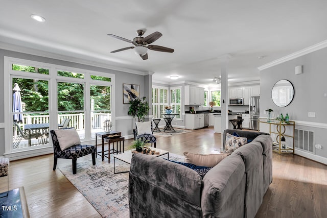 12 Gatesway Ct, Durham, NC 27707 - living area featuring a ceiling fan, ornamental molding, and light wood finished floors