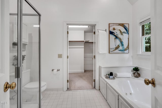 12 Gatesway Ct, Durham, NC 27707 - full bath with a stall shower, a spacious closet, tile patterned flooring, and vanity