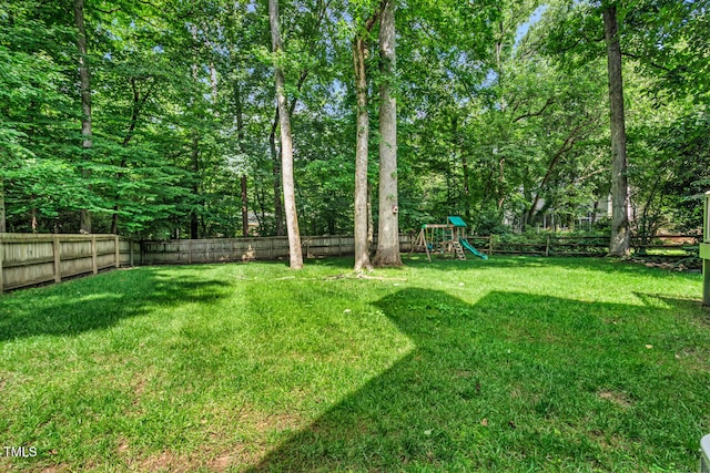12 Gatesway Ct, Durham, NC 27707 - fenced backyard with a playground
