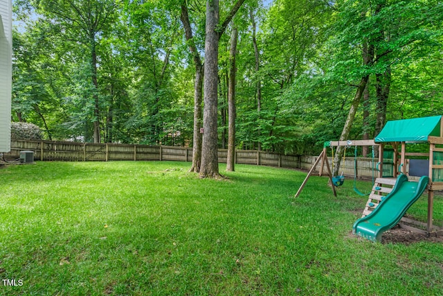 12 Gatesway Ct, Durham, NC 27707 - fenced backyard featuring a playground