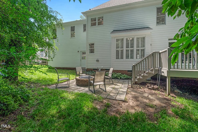 12 Gatesway Ct, Durham, NC 27707 - rear view of property featuring a fire pit, a patio area, a wooden deck, and stairs