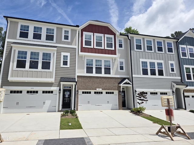 2203 Lambert Rd Unit 67, Cary, NC 27519 - multi unit property with board and batten siding, driveway, and a garage