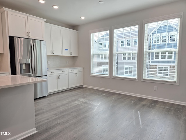 2203 Lambert Rd Unit 67, Cary, NC 27519 - kitchen with stainless steel refrigerator with ice dispenser, recessed lighting, plenty of natural light, and baseboards