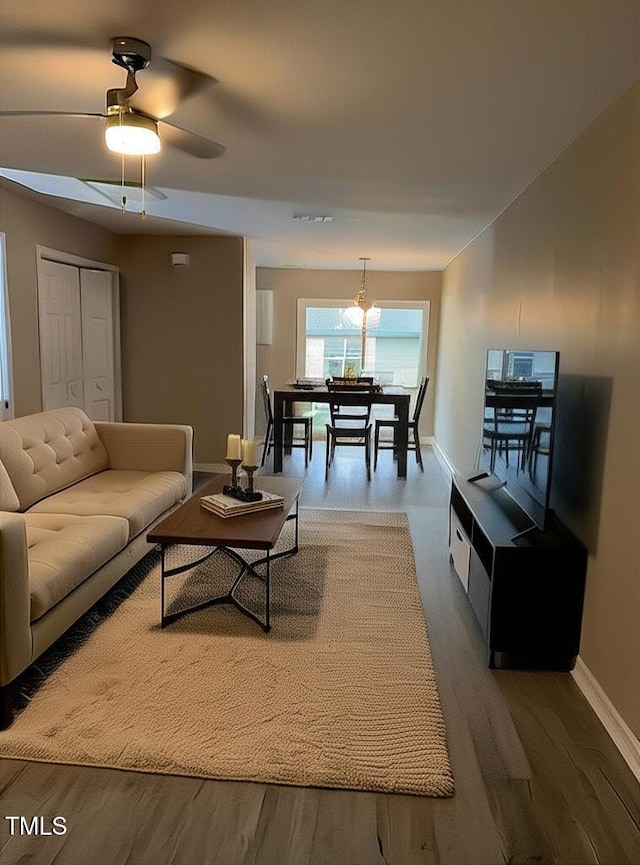 7710 River Field Dr, Raleigh, NC 27616 - living area featuring wood finished floors, baseboards, and a ceiling fan