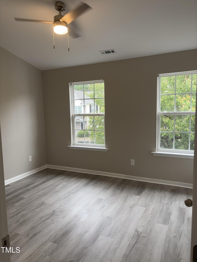 7710 River Field Dr, Raleigh, NC 27616 - unfurnished room with wood finished floors, plenty of natural light, ceiling fan, and baseboards