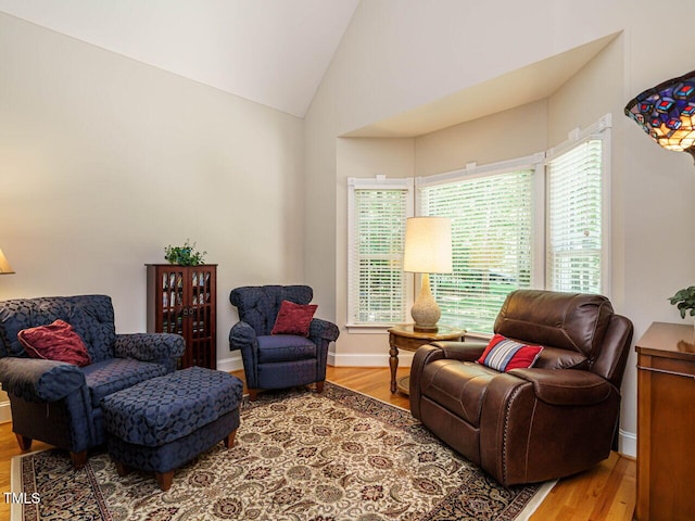 8504 Carlton Oaks Dr, Wake Forest, NC 27587 - sitting room with lofted ceiling and wood finished floors