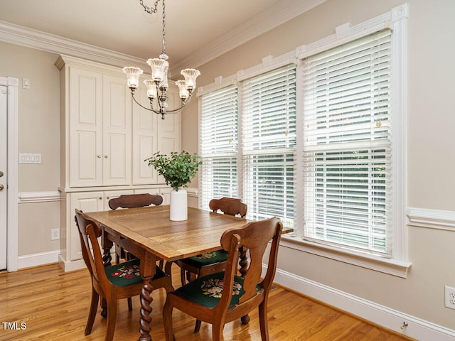8504 Carlton Oaks Dr, Wake Forest, NC 27587 - dining room with a chandelier, light wood finished floors, plenty of natural light, and ornamental molding