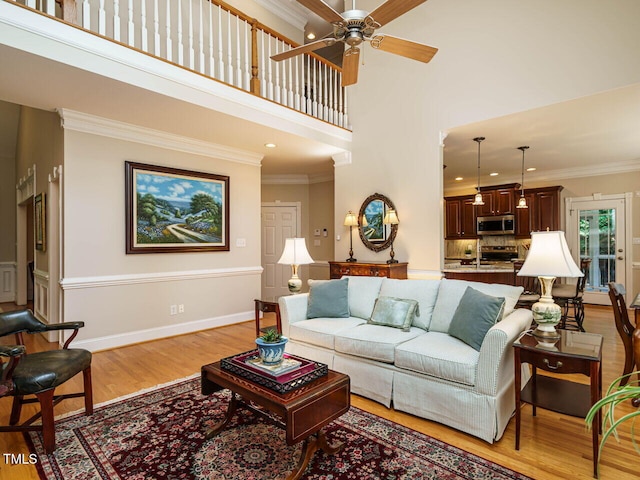 8504 Carlton Oaks Dr, Wake Forest, NC 27587 - living area with light wood-style flooring, a ceiling fan, ornamental molding, a high ceiling, and recessed lighting