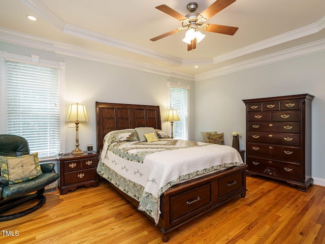 8504 Carlton Oaks Dr, Wake Forest, NC 27587 - bedroom with multiple windows, light wood finished floors, a raised ceiling, ornamental molding, and ceiling fan