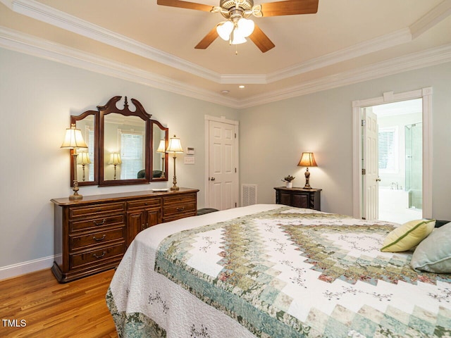 8504 Carlton Oaks Dr, Wake Forest, NC 27587 - bedroom featuring light wood-type flooring, ornamental molding, a raised ceiling, and ceiling fan